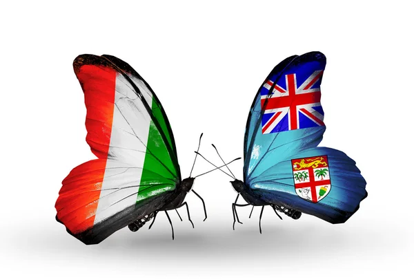 Butterflies with Cote Divoire and Fiji flags — Stock Photo, Image