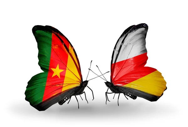 Butterflies with Cameroon and South Ossetia flags — Stock Photo, Image