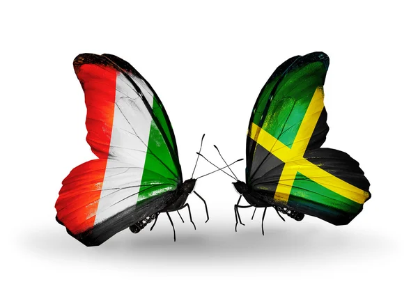 Butterflies with Cote Divoire and Jamaica flags — Stock Photo, Image