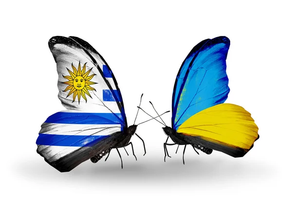 Butterflies with Uruguay and Ukraine flags — Stock Photo, Image