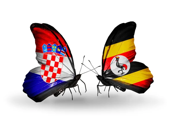 Schmetterlinge mit kroatischen und ugandischen Flaggen — Stockfoto