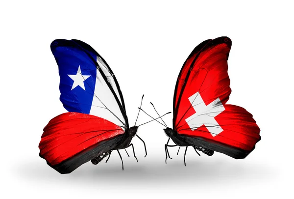 Papillons avec drapeaux Chili et Suisse — Photo