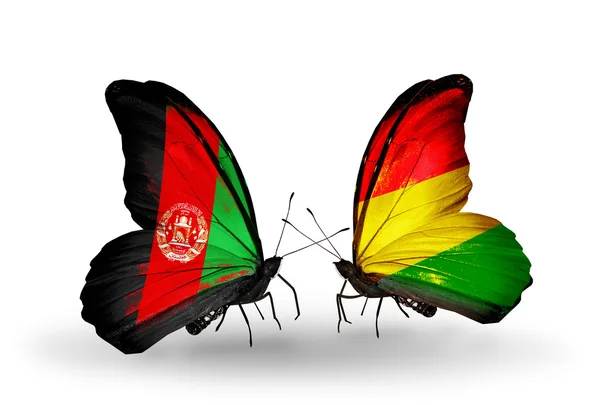Vlinders met afghanistan en bolivia vlaggen op vleugels — Stockfoto