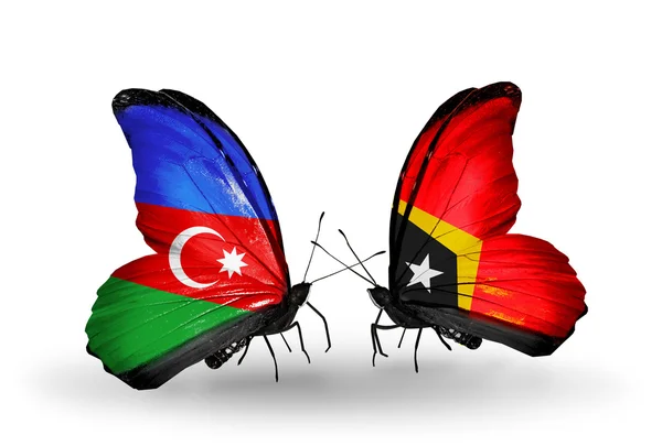 Butterflies with Barbados and East Timor flags — Stock Photo, Image