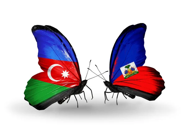 Butterflies with Barbados and Haiti flags — Stock Photo, Image