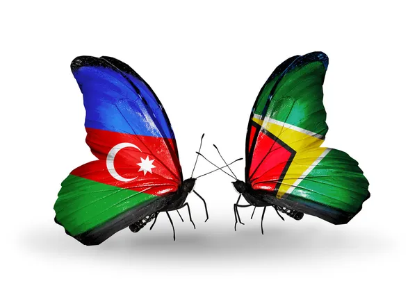 Butterflies with Barbados and Guyana flags — Stock Photo, Image