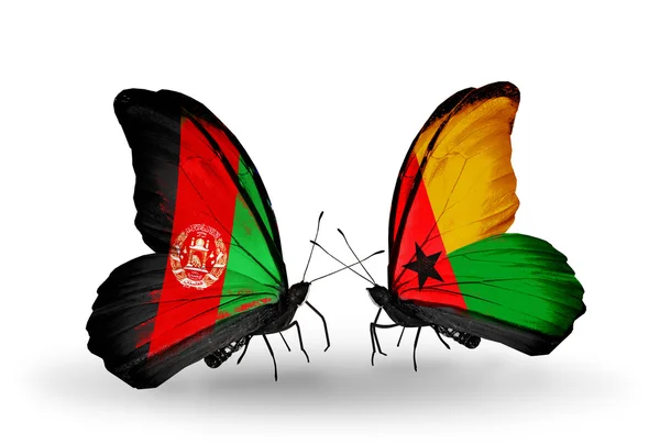 Mariposas con banderas de Afganistán y Guinea Bissau — Foto de Stock