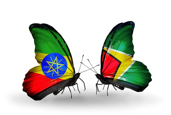 Butterflies with  Ethiopia and Guyana flags — Stock Photo, Image