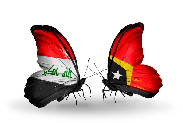 Borboletas com bandeiras do Iraque e Timor-Leste — Fotografia de Stock