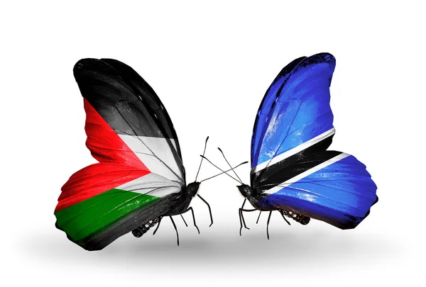 Бабочки с флагами Палестины и Ботсваны — стоковое фото