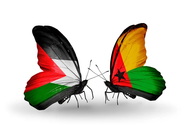 Butterflies with Palestine and Guinea Bissau flags — Stock Photo, Image