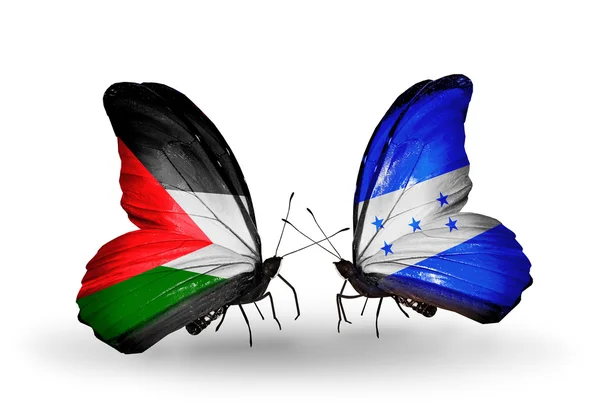 Butterflies with Palestine and Honduras flags — Stock Photo, Image