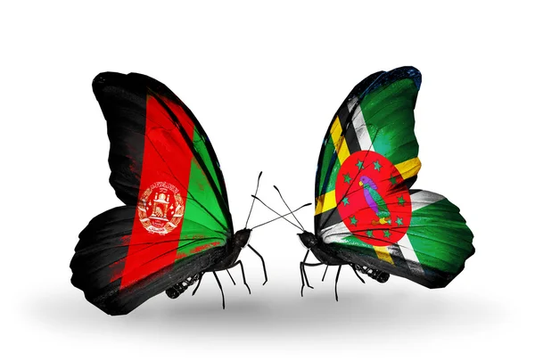 Fjärilar med afghanistan och dominica flaggor — Stockfoto