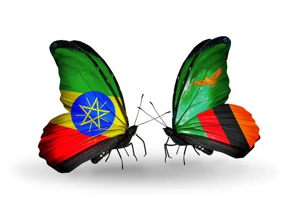 Vlinders met Ethiopië en zambia vlaggen — Stockfoto