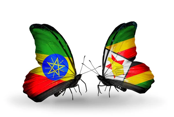 Butterflies with Ethiopia and Zimbabwe flags — Stock Photo, Image