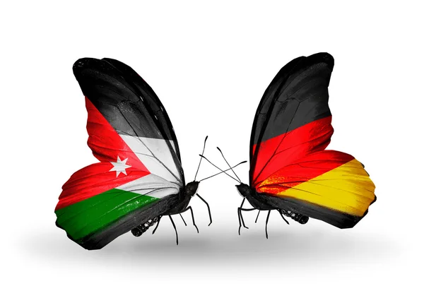 Mariposas con banderas de Jordania y Alemania — Foto de Stock