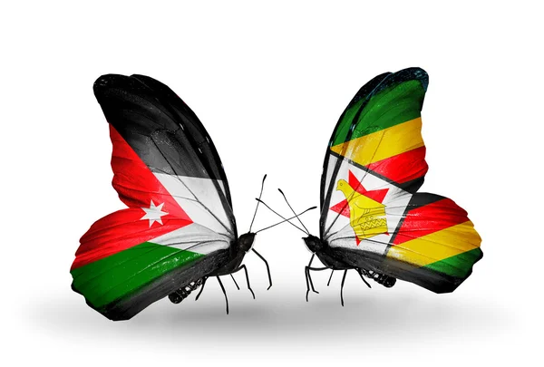 Butterflies with Jordan and Zimbabwe flags — Stock Photo, Image