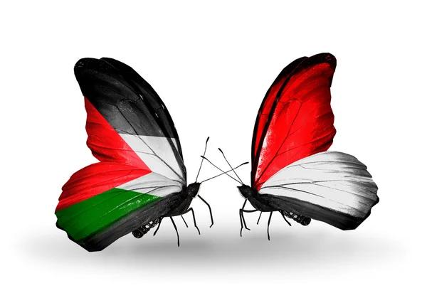 Butterflies with Palestine and Monaco, Indonesia flags — Stock Photo, Image
