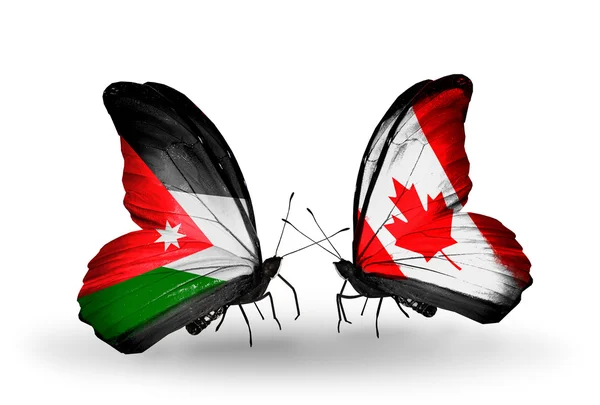 Fjärilar med Jordanien och Kanada flaggor — Stockfoto