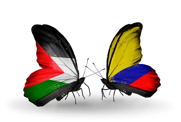 Butterflies with Palestine and Columbia flags — Stock Photo, Image