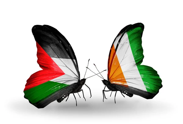 Schmetterlinge mit Palestin- und Cote-Divoire-Fahnen — Stockfoto