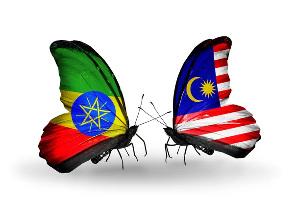Farfalle con bandiere Etiopia e Malesia — Foto Stock