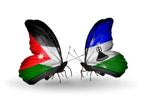 Borboletas com bandeiras da Jordânia e Lesoto — Fotografia de Stock