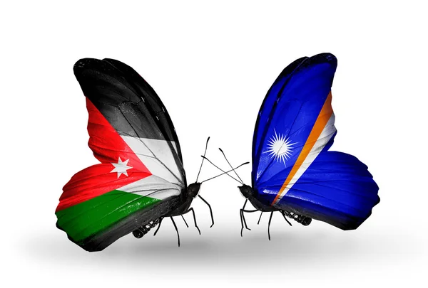 Butterflies with Jordan and Marshall islands flags — Stock Photo, Image