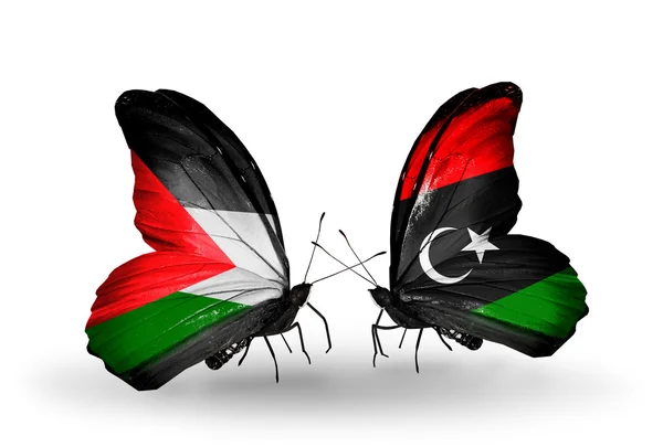 Бабочки с флагами Палестины и Ливии — стоковое фото