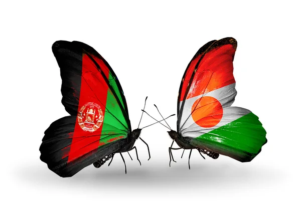 Duas borboletas com bandeiras do Afeganistão e do Níger — Fotografia de Stock