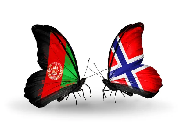 Duas borboletas com bandeiras do Afeganistão e Noruega — Fotografia de Stock