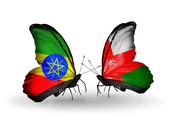 Two butterflies with flags of  Ethiopia and Oman — Stock Photo, Image