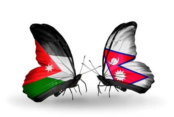 Two butterflies with flags of Jordan and Nepal — Stock Photo, Image