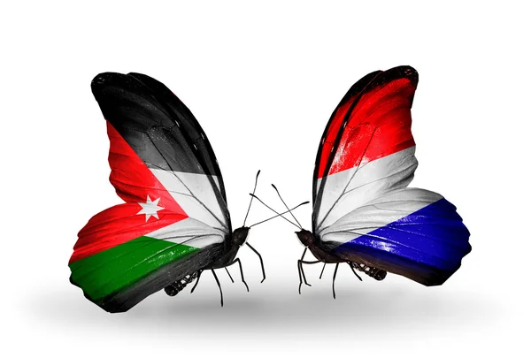 Dwa motyle z flagami jordan i Holandii — Zdjęcie stockowe