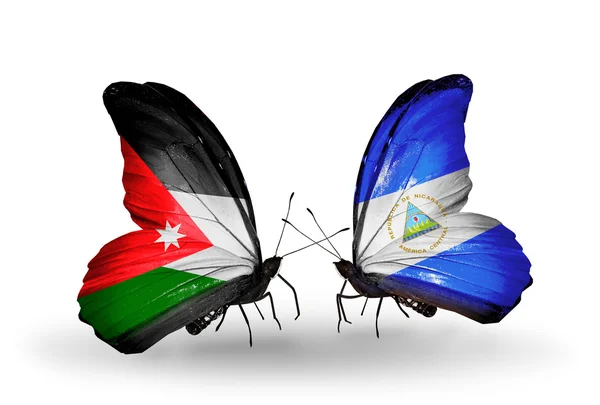 Due farfalle con bandiere di Giordania e Nicaragua — Foto Stock