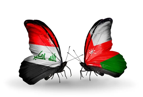 Two butterflies with flags of Iraq and Oman — Stock Photo, Image