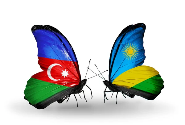 Twee vlinders met vlaggen van Azerbeidzjan en rwanda — Stockfoto