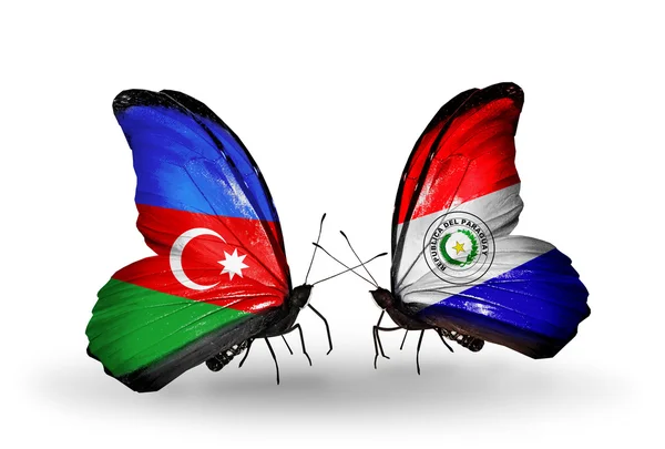 Dua kupu-kupu dengan bendera Azerbaijan dan Paraguay — Stok Foto