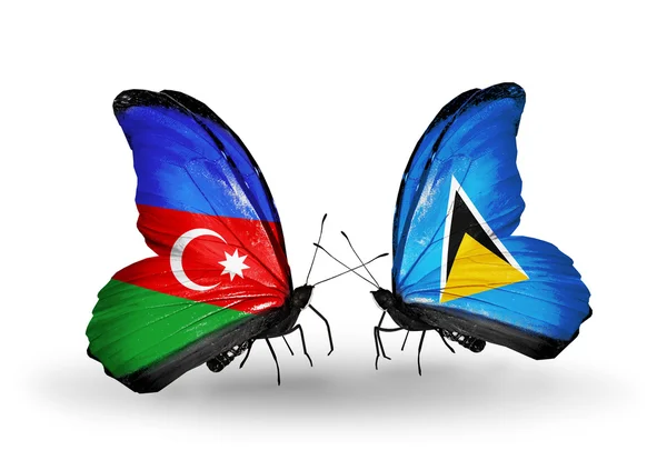 Twee vlinders met vlaggen van Azerbeidzjan en saint lucia — Stockfoto