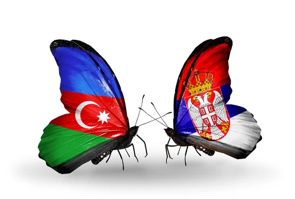 アゼルバイジャンとセルビアの国旗と 2 匹の蝶 — ストック写真