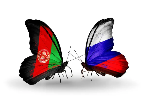 Dva motýli s vlajkami Afghánistánu a Ruska — Stock fotografie
