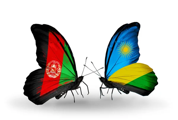 Две бабочки с флагами Афганистана и Руанды — стоковое фото
