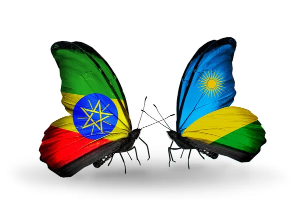Dwa motyle z flagi Etiopii i Rwandzie — Zdjęcie stockowe