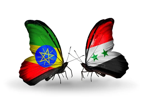 Twee vlinders met vlaggen van Ethiopië en Syrië — Stockfoto