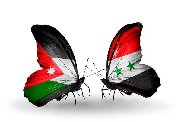 Ürdün ve Suriye bayrakları taşıyan iki kelebek — Stok fotoğraf