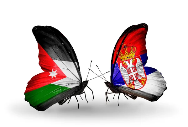 Dos mariposas con banderas de Jordania y Serbia — Foto de Stock