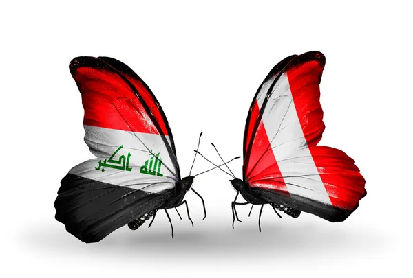 イラクとペルーの国旗と 2 匹の蝶 — ストック写真