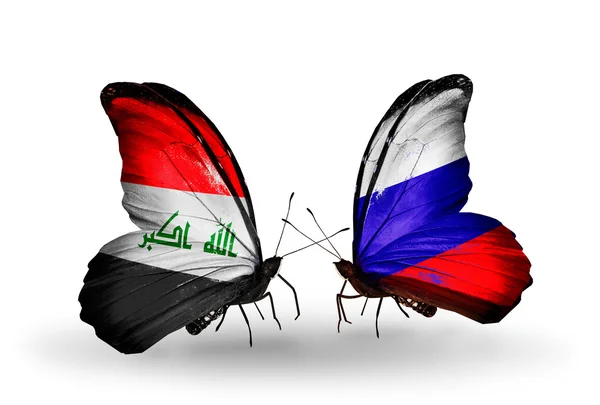 Twee vlinders met vlaggen van Irak en Rusland — Stockfoto