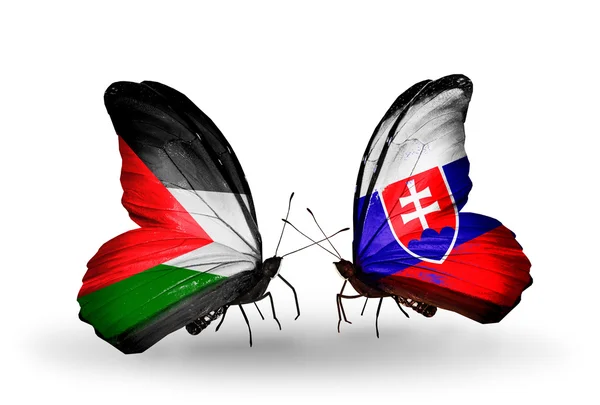 Dva motýli s vlajkami Palestiny a Slovenska — Stock fotografie