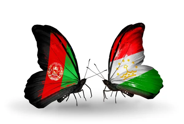 Duas borboletas com bandeiras do Afeganistão e do Tajiquistão — Fotografia de Stock